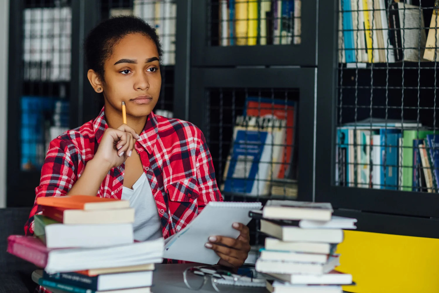 student studying in library